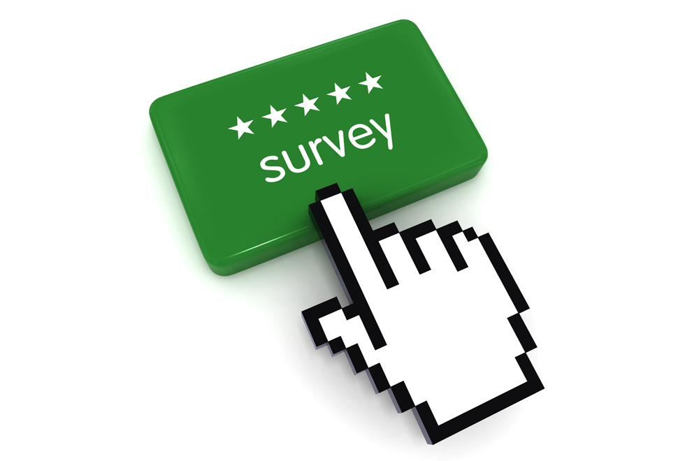 A white mouse pointer finger on a green button that says survey